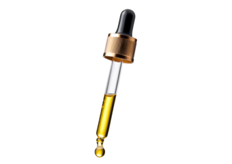 Cosmetic pipette with drops of cosmetic oil close-up isolated on a transparent or white background
