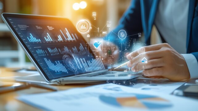 Businessman using digital tablet surfing the internet and working on laptop computer on office desk. Business man proofing e-document on tablet via mobile app