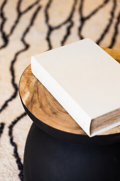 Elegant coffee table book on wooden surface