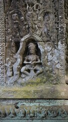 Cambodia, Siem Reap - patterns carved into a stone wall at the Angkor Wat temple complex
