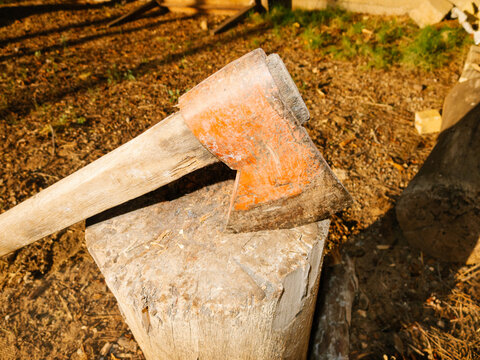 UGC Axe resting on a chopping board
