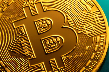 Golden bitcoin coin close up. Digital currency background