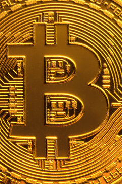Golden bitcoin coin close up. Digital currency background