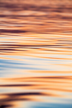 Reflections Of The Sunset In The Blue Waters Of An African River  