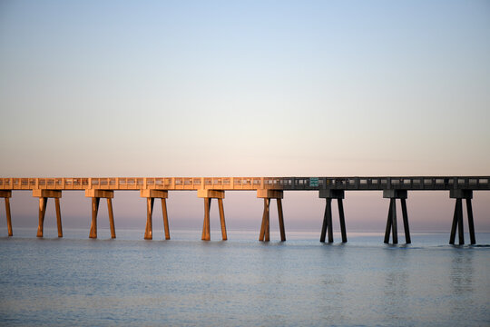 Pier Over The Ocean At Sunrise