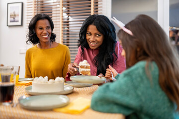 Sharing a cake slice during a festive gathering