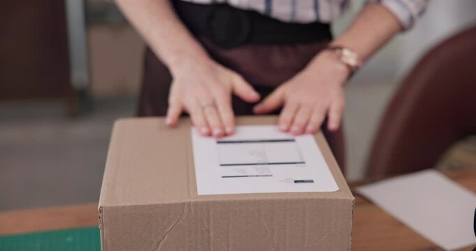 Woman, hands and box with label for logistics, distribution or online shipping at warehouse. Closeup, female person or distributor with packaging, parcel or cargo for invoice or shipment details