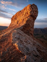 Sunrise over a dramatic rock formation