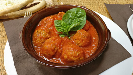 A plate of Italian beef Meatballs and tomato sauce, beef, sauce