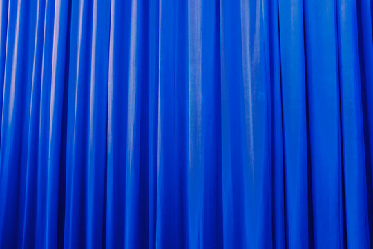 Blue velvet silk fabric textile theatre show curtain & soft lighting 