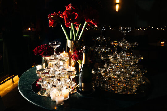 Luxurious Champagne Glass Tower with Red Roses and Candles