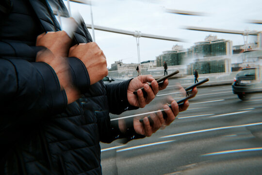 kaleidoscopic image of a man using his smartphone on the street