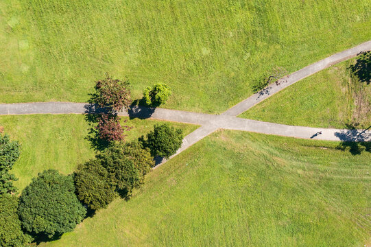 Aerial view of a park with intersecting paths and greenery