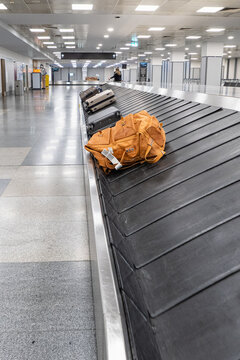 Luggage And Backpack On Airport Baggage Carousel