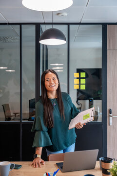 Confident professional presenting in a modern office