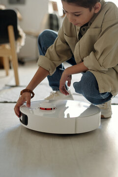 Kid Using Vacuum Bot when Doing Housework