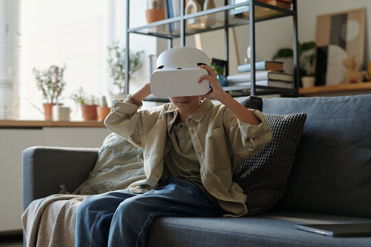 Young Boy Using VR Glasses when Playing Video Games at Home