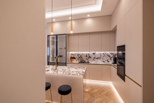 Modern kitchen with marble surfaces and minimalist design