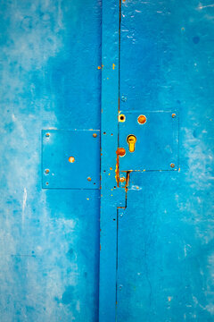 distressed, old blue door with lock