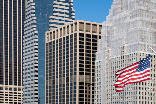 Skyscrapers and American flag at Manhattan