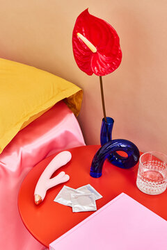 Modern bedside arrangement with vibrant accents and intimate ite