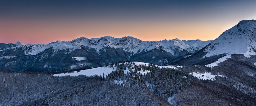 Pink sky and snowy mountains