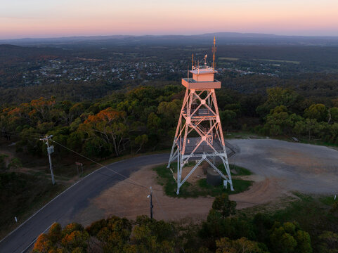 Lookout tower on a hilltop at sunset