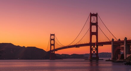 Obraz premium Captivating Sunset View of the Iconic Golden Gate Bridge Framed by Colorful Sky and Tranquil Waters, Showcasing Majestic Engineering and Natural Beauty