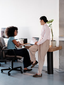 Employees Collaborating in a Modern Office Environment 