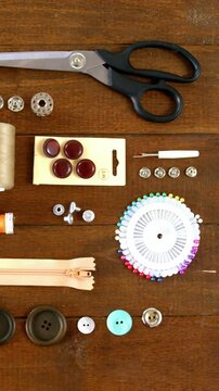 Close-up of set of threads and sewing tools