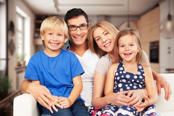 Mom, dad and child playing in the living room