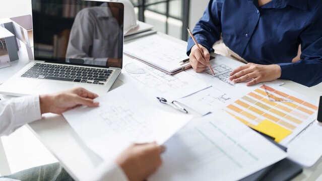 Architecture drawing on architectural project business architecture building construction Colleagues designer Planning Design on blueprint and compasses