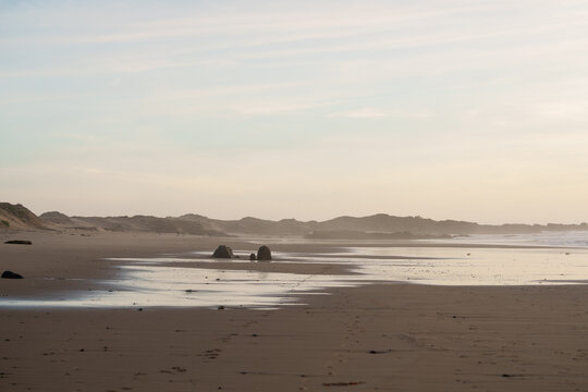 The beach at sunset in California - Powered by Adobe