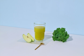 Fresh Green Juice With Apple and Kale on White Table
