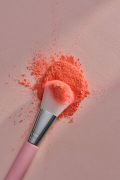 Makeup Brush With Pink Powder On Pink Background