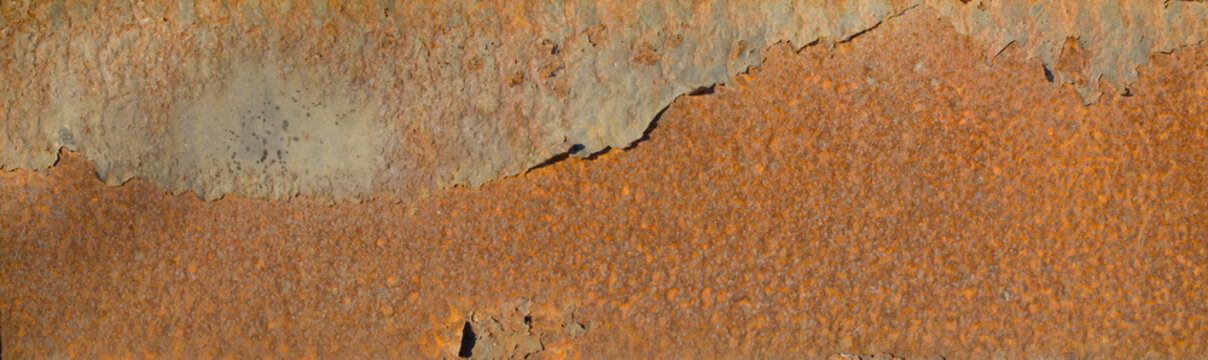 Panoramic image of rusting peeling metal