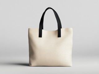 Beige Fabric Tote Bag with Black Handles Displayed in a Clean Studio Setting for Product Mockups