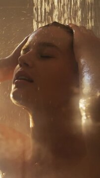 Woman taking a shower in bathroom