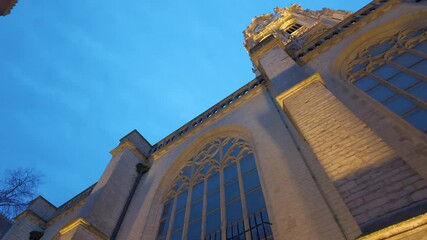 Antwerp, Belgium, 3rd of December, 2024, A breathtaking and stunning view of the Antwerp Cathedral intricate architectural design beautifully set against a twilight sky