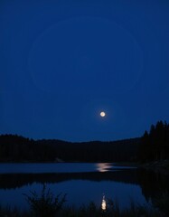 Fototapeta premium A bright moon reflects on the still waters of a secluded lake, surrounded by towering trees.