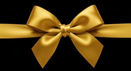 Elegant gold satin ribbon bow on black background for celebrations and gift wrapping
