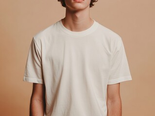 Person Wearing a Plain T-shirt Against a Neutral Background for Simple Fashion Display Shot
