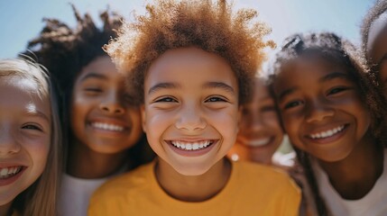 Fototapeta premium Diverse group of joyful children smiling together outside on a sunny day