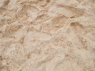 beach sand texture background with footprints