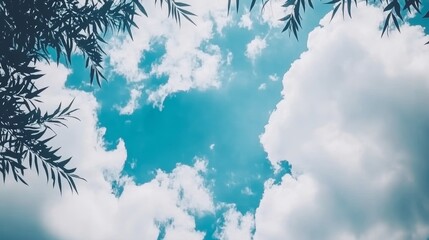 Obraz premium Serene Blue Sky with Fluffy Clouds and Willow Branches