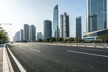 Obraz premium Wide asphalt road stretching through a modern cityscape with sleek skyscrapers and glass towers in the background, concrete highway, skyscraper, urban landscape, modern city
