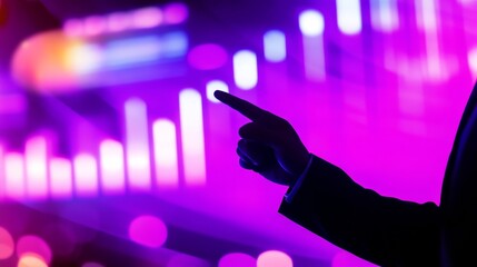 Business professional pointing at vibrant digital data visualization on a colorful background