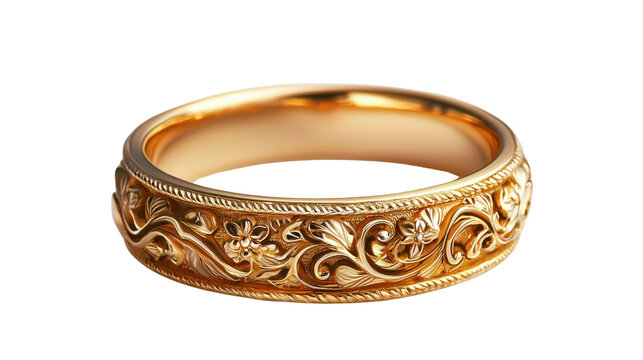 Closeup view of a gold ring with intricate floral engraving, set against a pure black background. The engraving features detailed, flowing floral patterns. The ring is a band style.