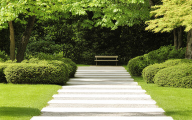 Serene garden pathway leading to a peaceful bench surrounded by lush greenery