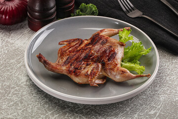 Grilled quail in the plate